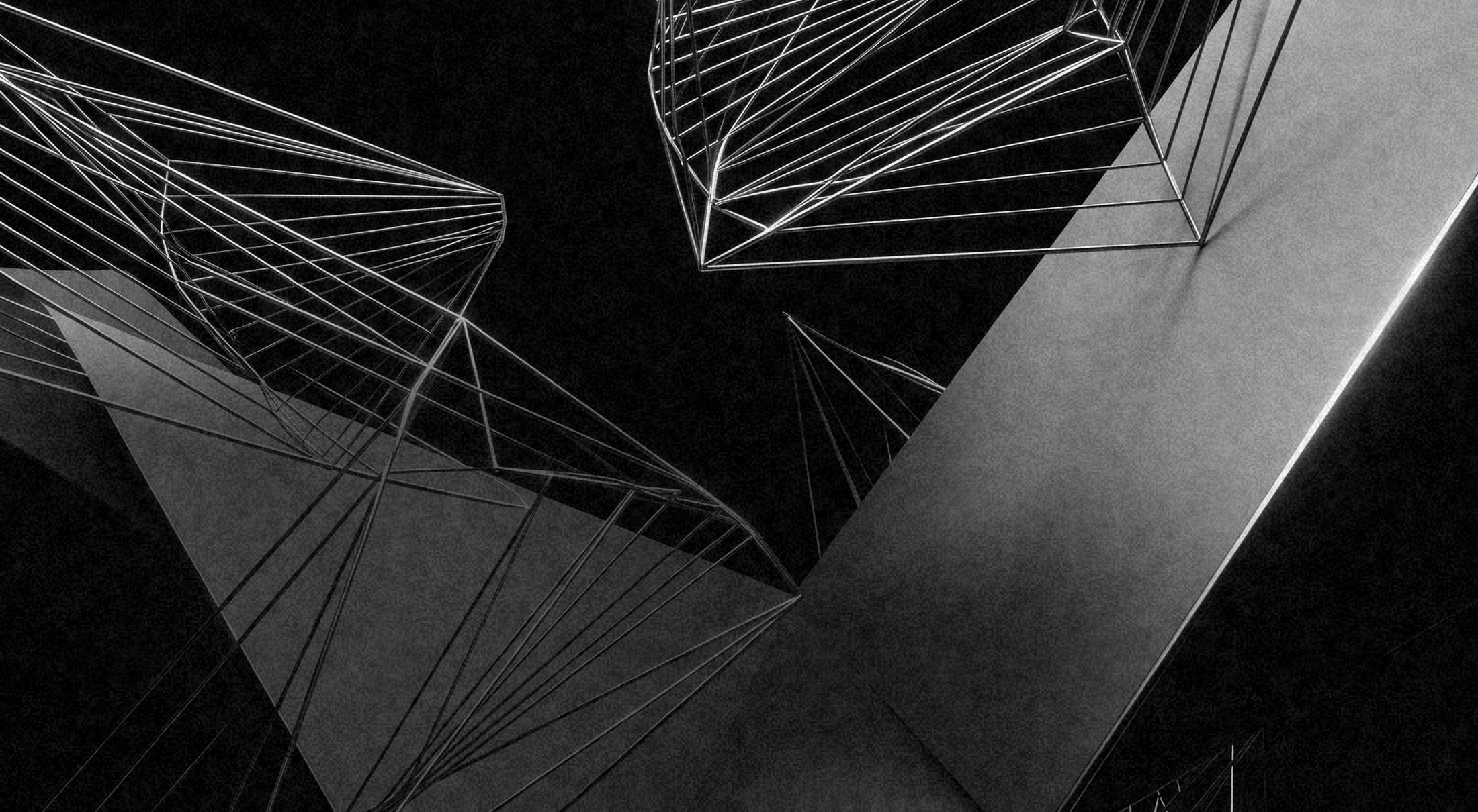 A monochrome render: wireframe polyhedra and solid white planes suspended against black, lit along their edges.