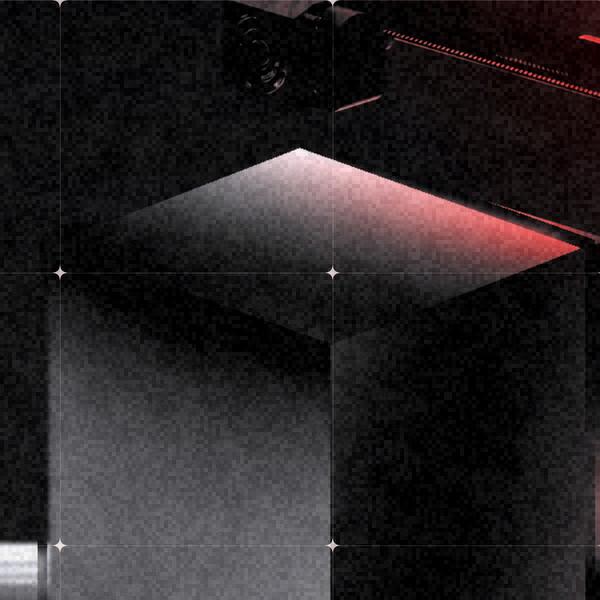 A Recalibre render: a black cube on a perforated steel bed, lit in red.